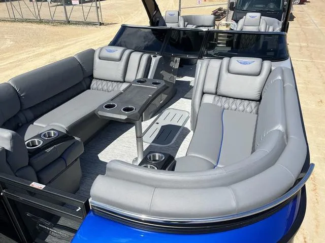 Slide: The Image of 2024 Bennington 25 QFBWA pontoon boat with luxurious gray seating and cup holders. - 18