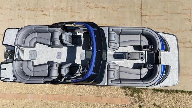 Slide: The Image of 2024 Bennington 25 QFBWA pontoon boat, aerial view, spacious seating, modern design. - 3