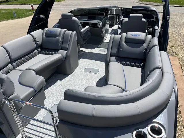 Slide: The Image of 2024 Bennington 25 QFBWA pontoon boat with luxurious gray seating and spacious layout. - 8