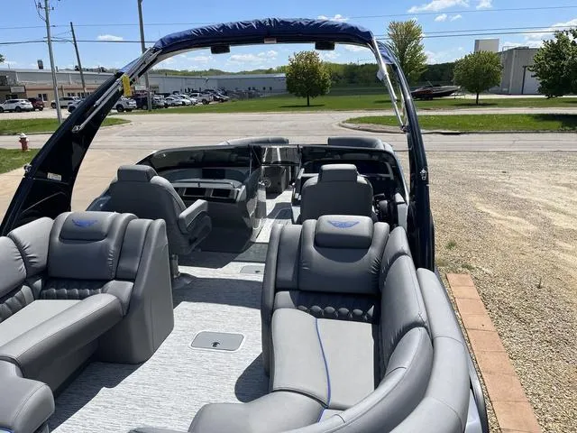 Slide: The Image of 2024 Bennington 25 QFBWA pontoon boat with luxurious seating and modern design. - 9