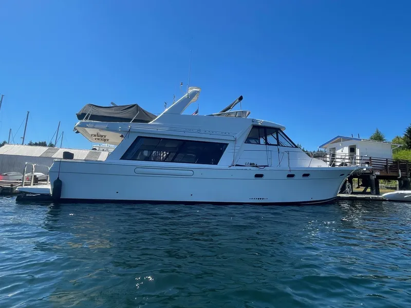 The Image of Bayliner 4700 yacht from 1994 docked on a sunny day. - 0