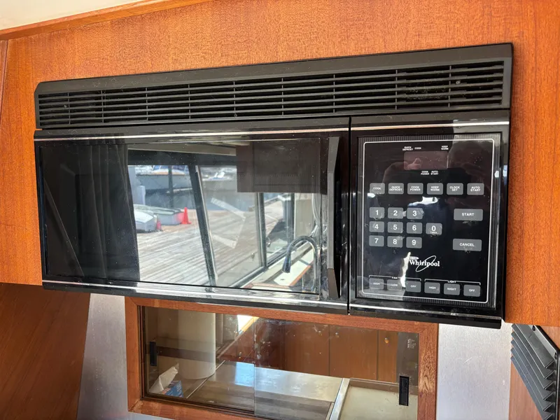 Slide: The Image of Built-in microwave in a 1994 Bayliner 4700 yacht kitchen. - 13