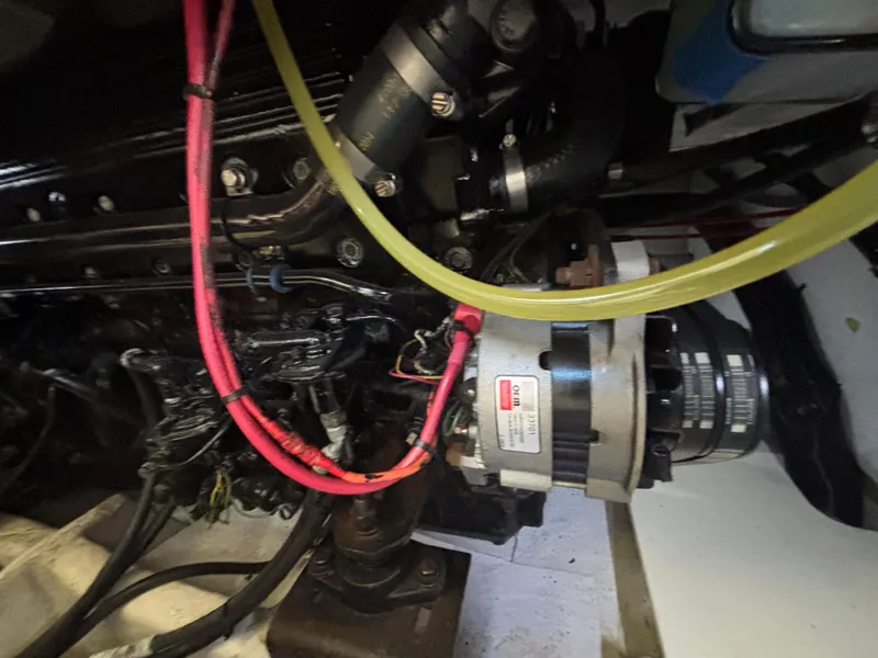 Slide: The Image of Engine compartment of a 1994 Bayliner 4700 boat, featuring visible wiring and components. - 27