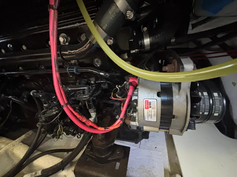 Slide: The Image of Engine compartment of a 1994 Bayliner 4700 with visible wiring and components. - 28