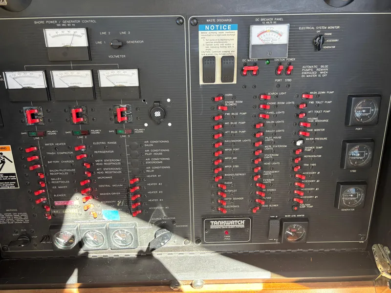 Slide: The Image of Electrical control panel of a 1994 Bayliner 4700 boat, featuring switches and gauges. - 34