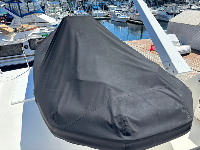Slide: The Image of Covered boat on a Bayliner 4700, 1994 model, docked at a marina. - 5