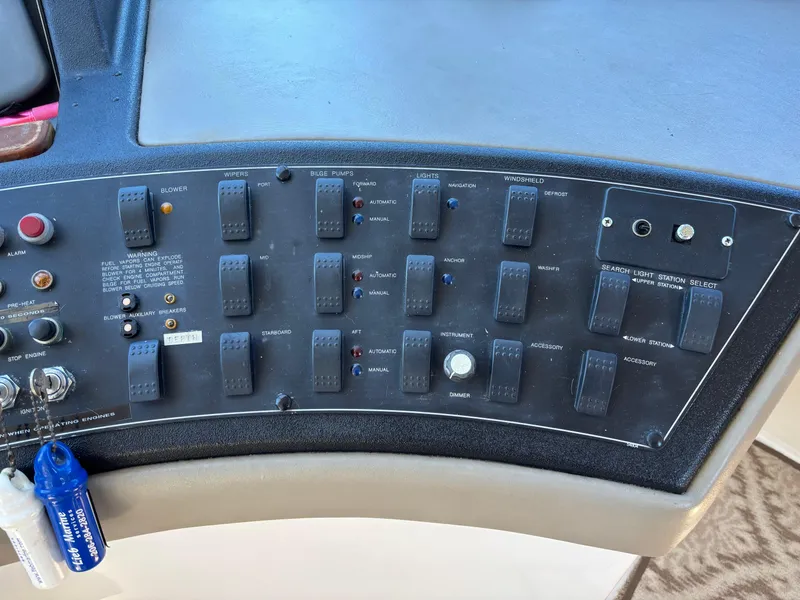 Slide: The Image of Control panel of a 1994 Bayliner 4700 boat with various switches and indicators. - 8