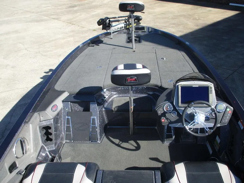 Slide: The Image of 2018 Ranger Z520C boat interior with steering console and seating. - 8