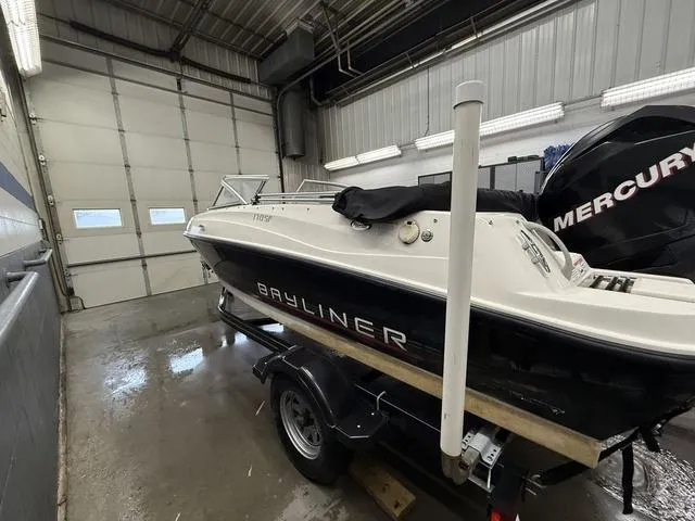 Slide: The Image of 2012 Bayliner 170SF boat in garage, on trailer, with Mercury engine. - 3