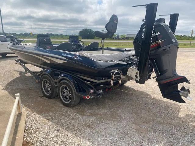 Slide: The Image of 2016 Ranger 522D boat with Yamaha motor on a trailer, parked outdoors. - 10