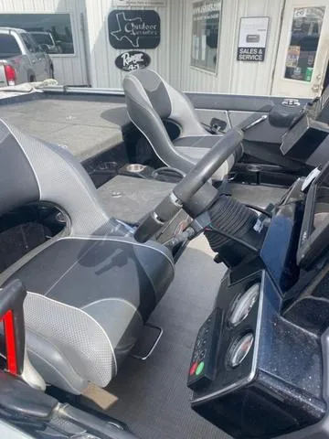 Slide: The Image of Interior of a 2016 Ranger 522D boat with modern seating and dashboard controls. - 6