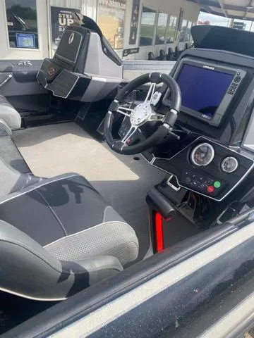 Slide: The Image of Interior of a 2016 Ranger 522D boat with modern dashboard and steering wheel. - 7