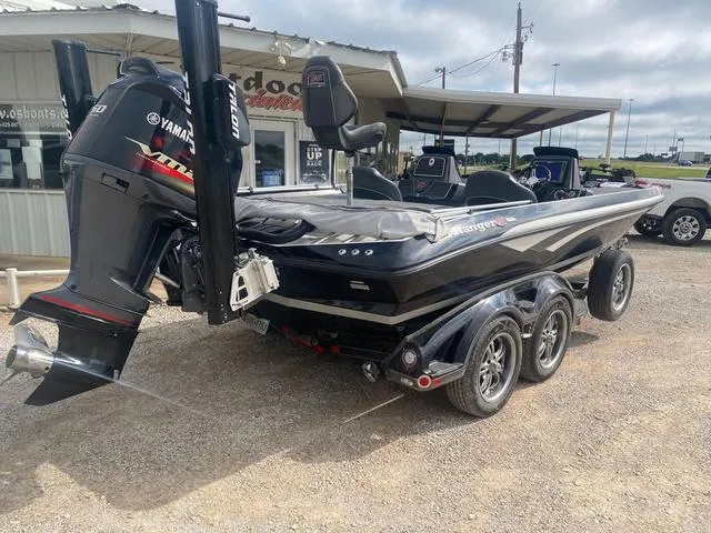 Slide: The Image of 2016 Ranger 522D boat with Yamaha engine, parked on a trailer in a lot. - 8
