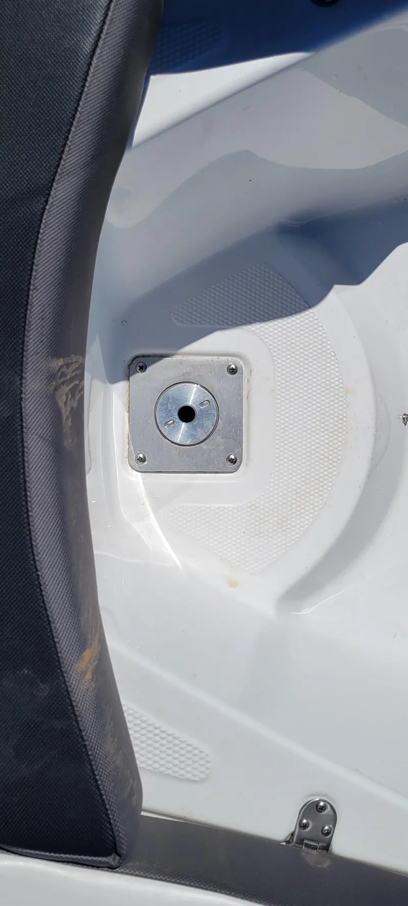 Slide: The Image of 2021 Bass Tracker TAHOE 550TF boat interior detail with seat and metal fixture. - 12