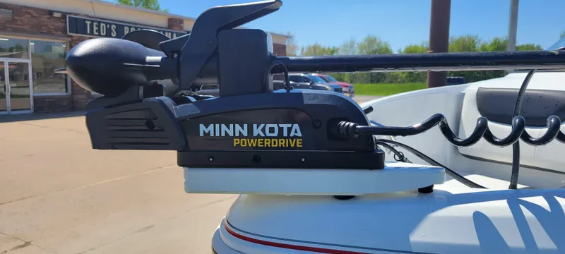 Slide: The Image of Minn Kota PowerDrive on 2021 Bass Tracker TAHOE 550TF boat, parked outdoors. - 17