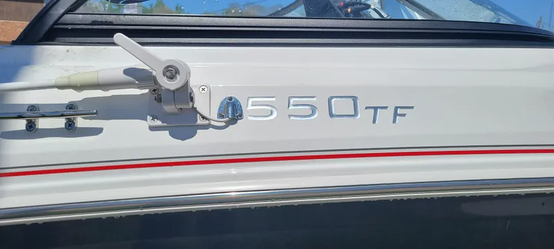 Slide: The Image of 2021 Bass Tracker TAHOE 550TF boat side view with model lettering. - 21