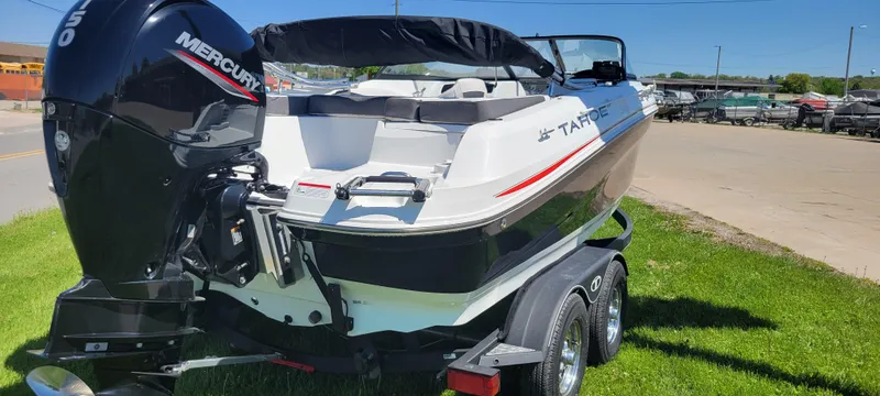 Slide: The Image of 2021 Bass Tracker TAHOE 550TF boat with Mercury engine on a trailer. - 22