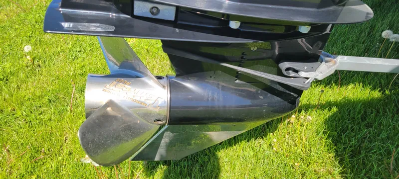Slide: The Image of 2021 Bass Tracker TAHOE 550TF boat propeller on grass. - 24