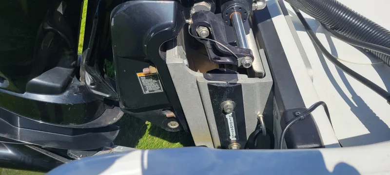 Slide: The Image of 2021 Bass Tracker TAHOE 550TF boat engine close-up, showcasing mechanical components. - 25