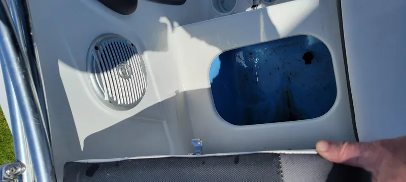 Slide: The Image of 2021 Bass Tracker TAHOE 550TF boat interior with speaker and storage compartment. - 31