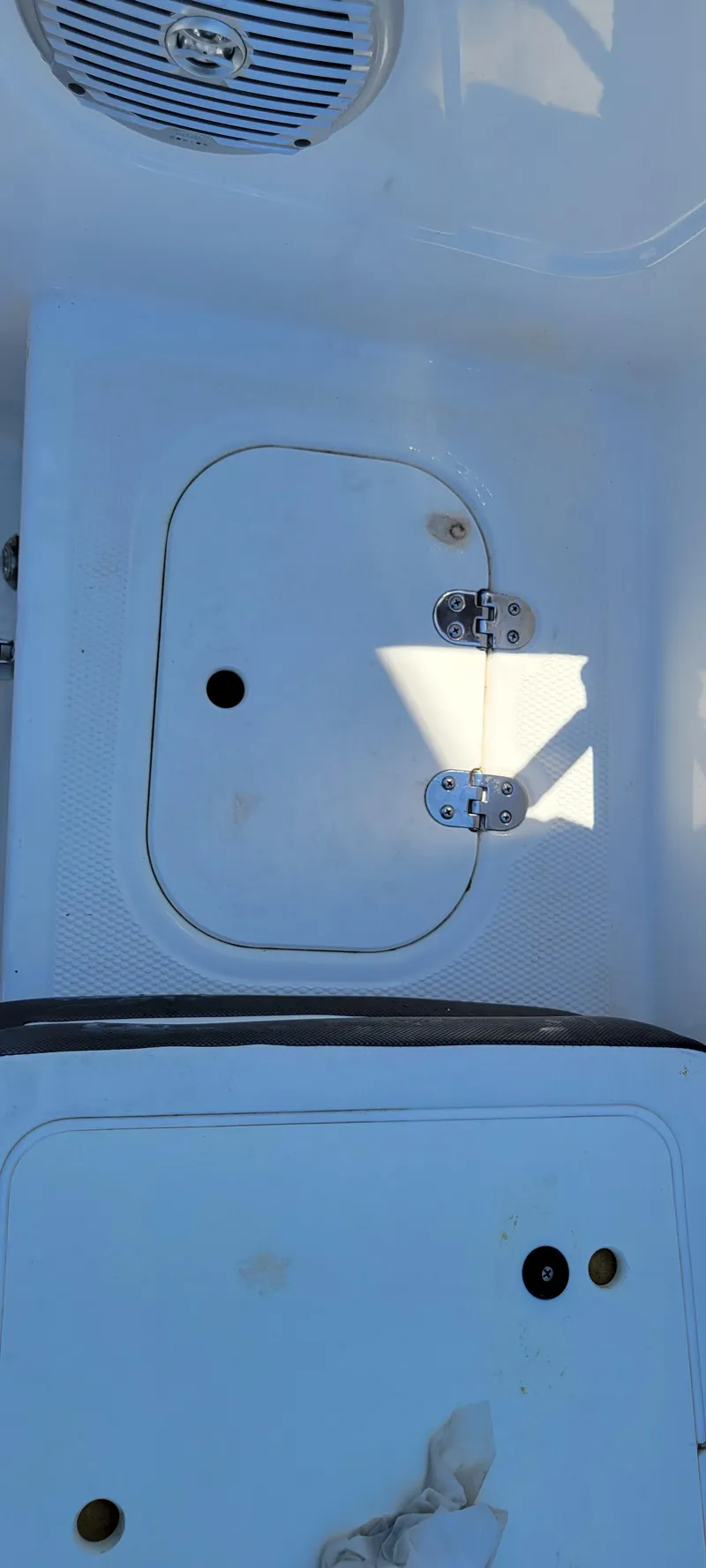 Slide: The Image of 2021 Bass Tracker TAHOE 550TF boat deck with storage compartment and speaker. - 32