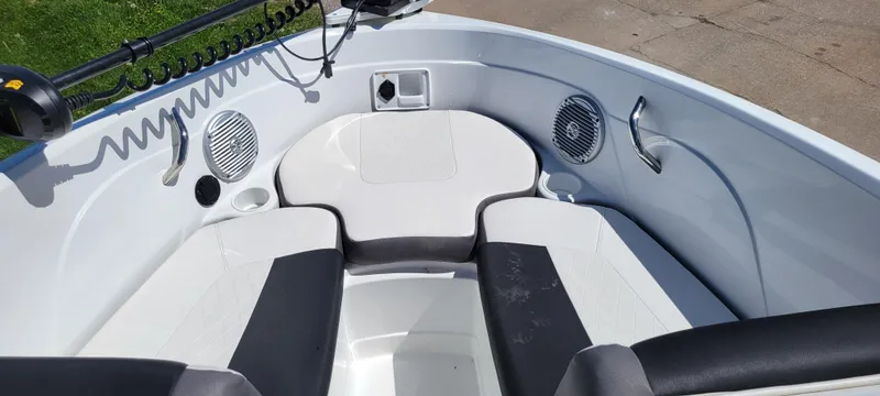 Slide: The Image of 2021 Bass Tracker TAHOE 550TF boat interior with seating and speakers. - 33