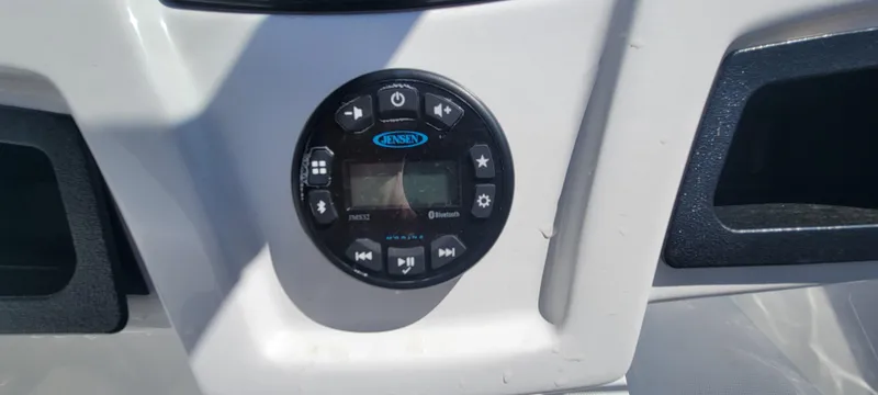 Slide: The Image of Control panel of 2021 Bass Tracker TAHOE 550TF boat with Jensen audio system. - 38