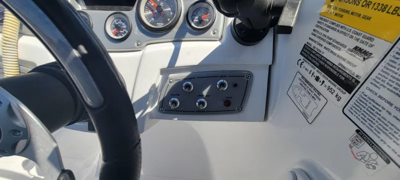 Slide: The Image of Control panel of 2021 Bass Tracker TAHOE 550TF boat with gauges and switches. - 40