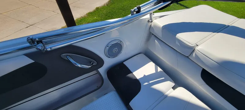 Slide: The Image of 2021 Bass Tracker TAHOE 550TF boat interior with white and black seating. - 44