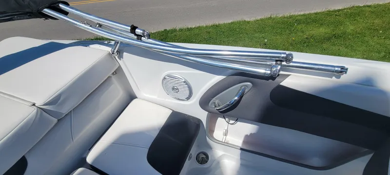 Slide: The Image of 2021 Bass Tracker TAHOE 550TF boat interior with seating and speaker detail. - 45