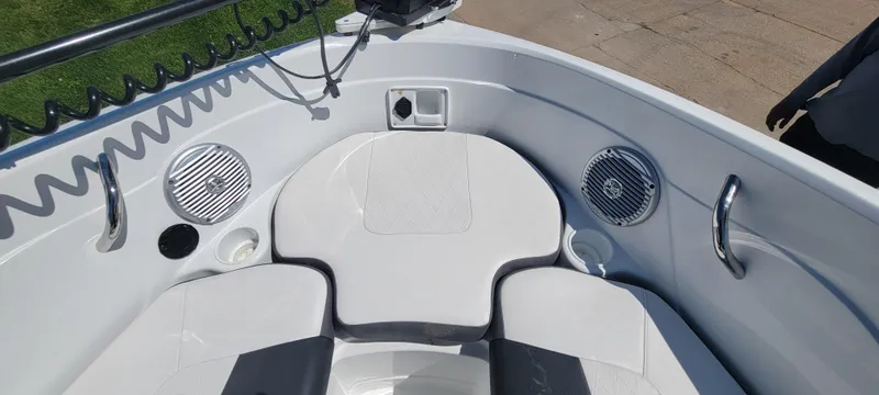 Slide: The Image of 2021 Bass Tracker TAHOE 550TF boat interior with seating and speakers. - 48
