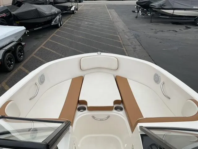 Slide: The Image of 2020 Bayliner VR4 Bowrider I/O with spacious bow seating and cup holders. - 12