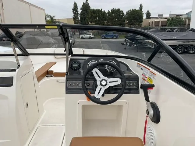 Slide: The Image of 2020 Bayliner VR4 Bowrider I/O dashboard with steering wheel and controls. - 13