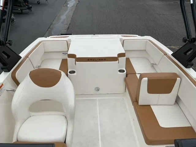 Slide: The Image of 2020 Bayliner VR4 Bowrider I/O interior with white and tan seating. - 8