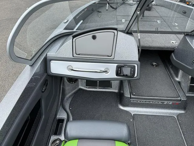 Slide: The Image of 2020 Ranger 212LS boat interior with dashboard and seating area. - 4