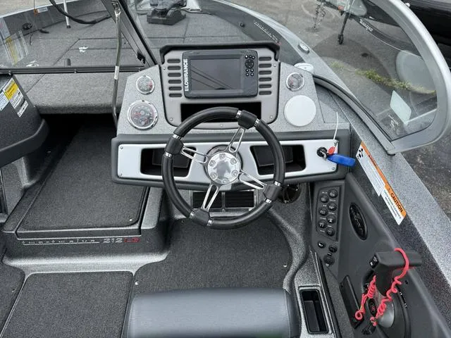 Slide: The Image of 2020 Ranger 212LS boat dashboard with steering wheel and electronic display. - 5