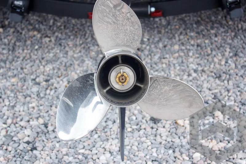 Slide: The Image of Propeller of 2025 Caymas CX 21 PRO boat on gravel surface. - 11