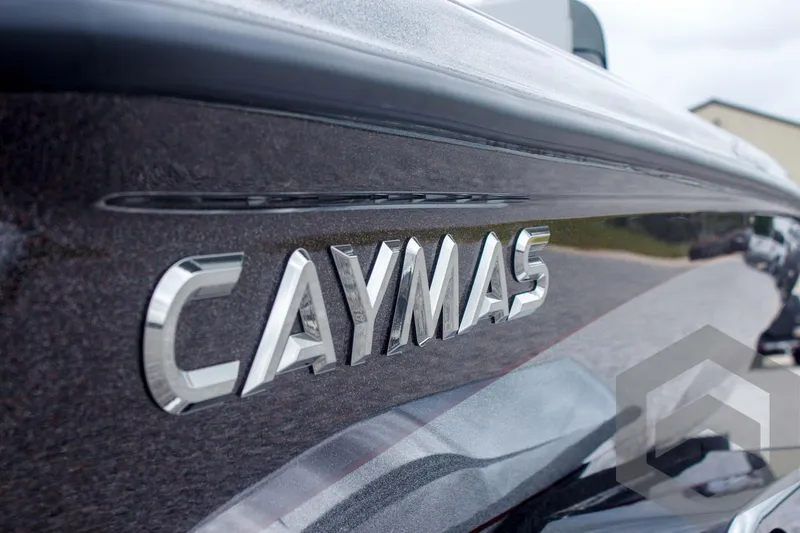 Slide: The Image of 2025 Caymas CX 21 PRO boat with sleek design and metallic logo. - 13