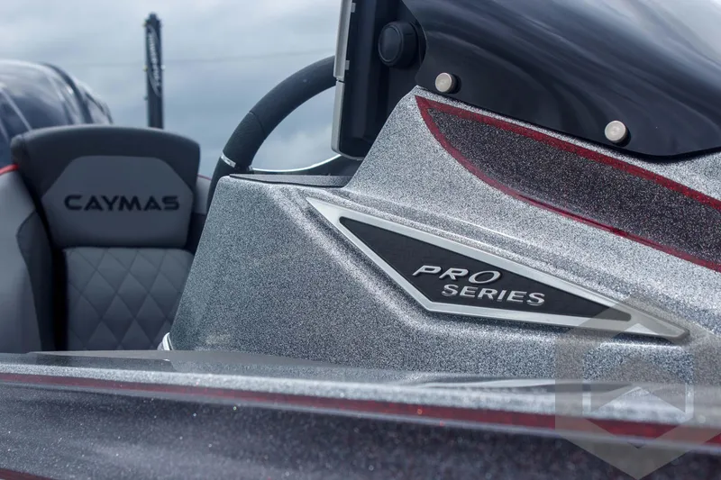 Slide: The Image of 2025 Caymas CX 21 PRO boat interior with "Pro Series" branding, featuring sleek design elements. - 16