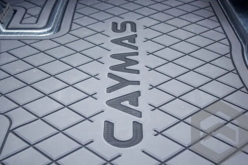 Slide: The Image of 2025 Caymas CX 21 PRO boat floor mat with logo and geometric pattern. - 22