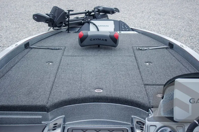 Slide: The Image of 2025 Caymas CX 21 PRO boat deck with Garmin equipment and storage compartments. - 23