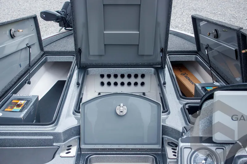 Slide: The Image of 2025 Caymas CX 21 PRO boat storage compartments with organized fishing gear and equipment. - 24