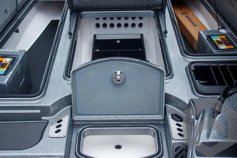 Slide: The Image of 2025 Caymas CX 21 PRO boat interior with storage compartments and equipment. - 27