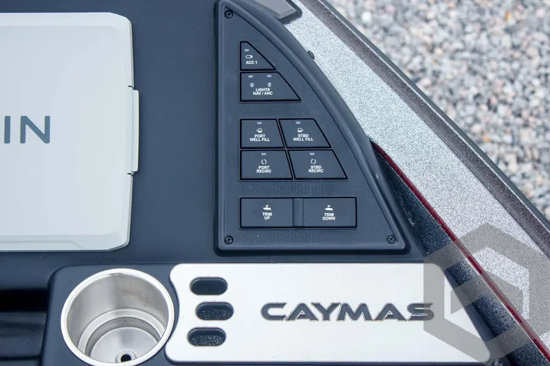 Slide: The Image of Control panel of 2025 Caymas CX 21 PRO boat with labeled buttons and logo. - 31
