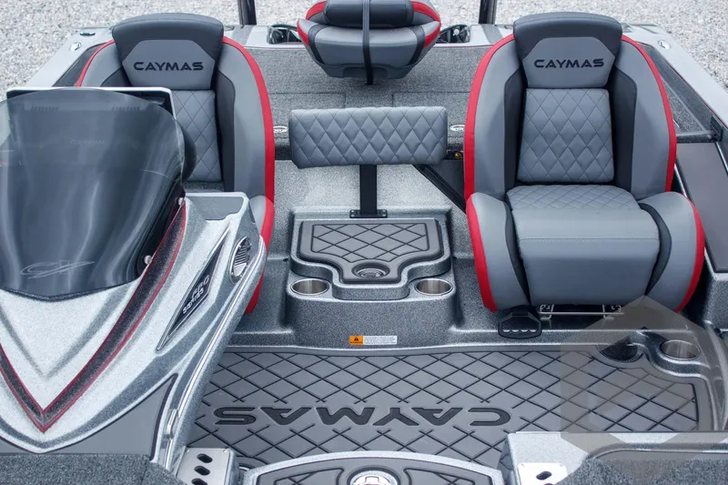 Slide: The Image of 2025 Caymas CX 21 PRO boat interior with gray and red seating, featuring diamond stitching. - 32