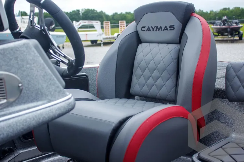 Slide: The Image of 2025 Caymas CX 21 PRO boat seat with gray and red upholstery, featuring diamond stitching. - 34