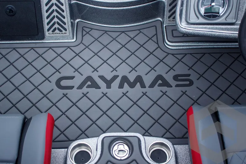 Slide: The Image of 2025 Caymas CX 21 PRO boat interior with logo and textured flooring. - 37