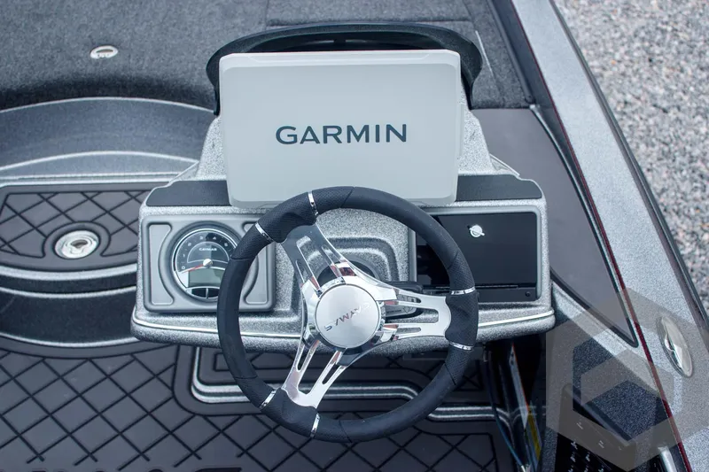 Slide: The Image of 2025 Caymas CX 21 PRO boat dashboard with Garmin display and steering wheel. - 38
