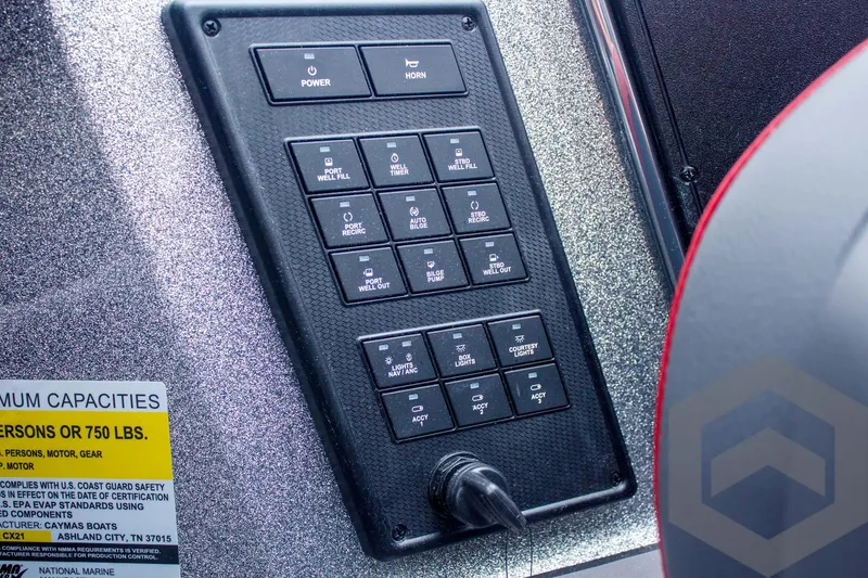 Slide: The Image of Control panel of 2025 Caymas CX 21 PRO boat with labeled switches and capacity warning. - 39