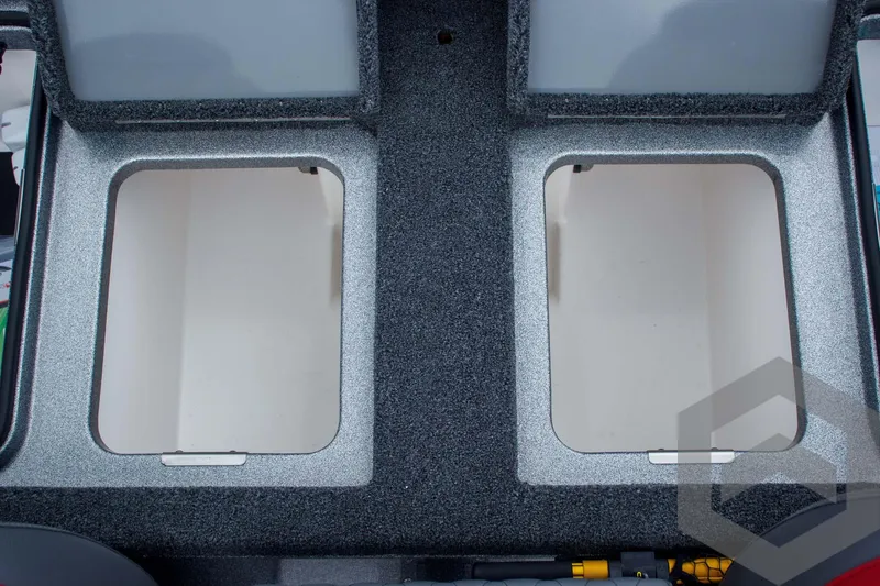 Slide: The Image of 2025 Caymas CX 21 PRO boat storage compartments, open and empty, with textured interior. - 45